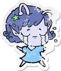 distressed sticker of a cartoon crying alien girl