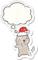 cute cartoon christmas cat and thought bubble as a distressed worn sticker