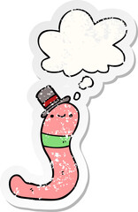 cute cartoon worm and thought bubble as a distressed worn sticker