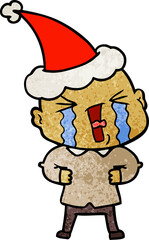 textured cartoon of a crying bald man wearing santa hat