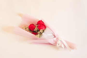 Bouquet of Red rose flowers with white flowers decorated on beige background, Bouquet flowers for Valentines and special days