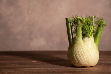 Fresh Florence fennel bulbs or Fennel bulb on wooden background. Healthy and benefits of Florence fennel bulbs