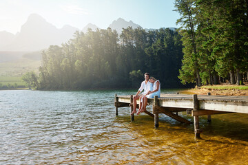 Love, relax and pier with couple at lake for bonding, romance and affectionate date. Nature, travel...
