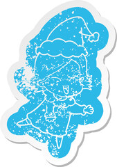 happy cartoon distressed sticker of a girl wearing santa hat