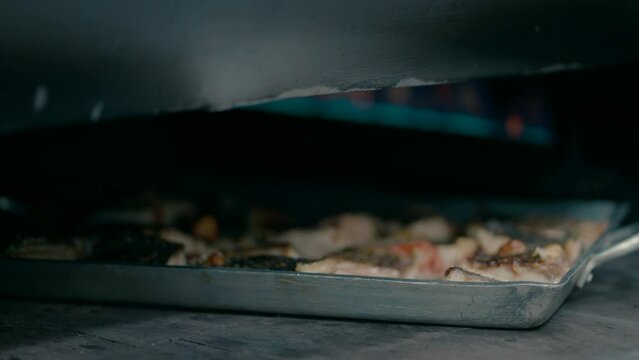 Fish is cooked in a gas oven. close up shot