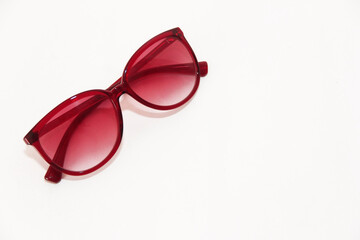 Women's designer fashion sunglasses in a plastic frame.