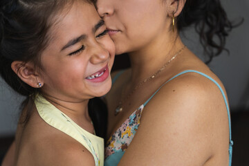 close up portrait of a mother and her super cute little girl