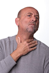 Close up headshot confident serious concentrated man over 50 looking at camera studio portrait, isolated on white studio background