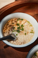 A bowl of congee or porridge with boiled rice