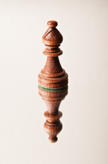 Obraz na płótnie Canvas chess piece of Bishop on a reflective surface