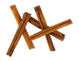 Top view of a group of cinnamon sticks isolated on a white background.