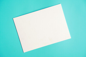 blank note paper on blue background