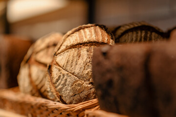 Freshly baked bread is served in baskets on the bakery counter  close-up view