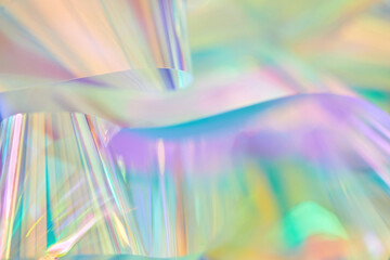 Close-up of ethereal pastel neon mint, turquoise, blue, purple holographic metallic foil...