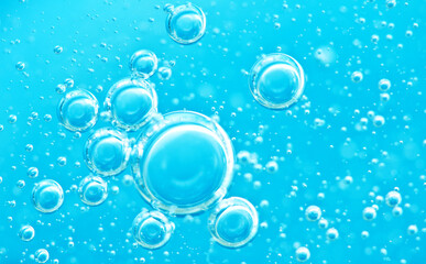 Turquoise background water texture close up with bubbles underwater