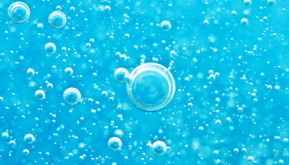 Turquoise background water texture close up with bubbles underwater
