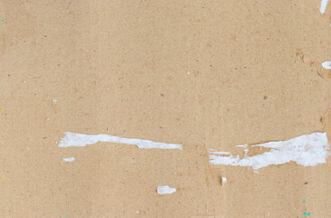 Texture of corrugated cardboard with paper torn out of the box.