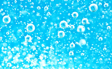 Turquoise background water texture close up with bubbles underwater