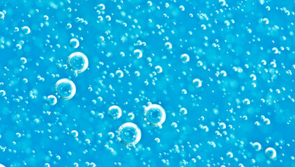 Turquoise background water texture close up with bubbles underwater