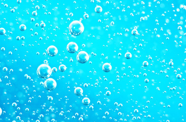 Turquoise background water texture close up with bubbles underwater