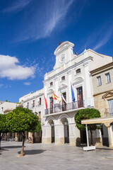 Flags at the facade of the historic town hall in Merida, Spain