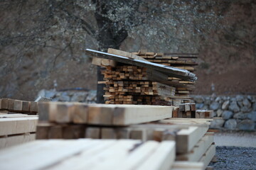 wooden slats and boards on the chamber, stone and wood in the background of the yard