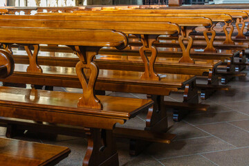 Rhythm of wooden church pews in a sunny day