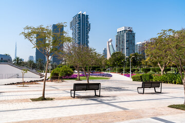 Dubai, United Arab Emirates - March 12, 2023:View of Dubai skyscrapers while walking at Zabeel park during a sunny day
