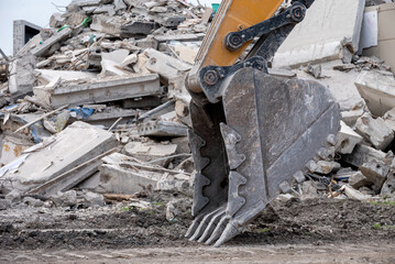 Fototapeta na wymiar construction equipment destroys affected houses war in Ukraine