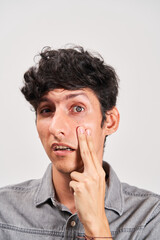 Young man has cataract checked in his eye.