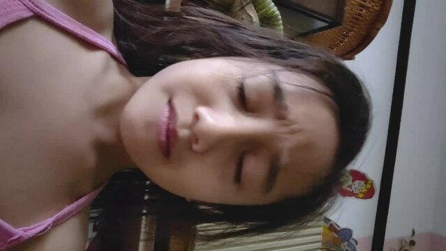 Selangor, Malaysia - March 1, 2023, a Little girl doing the famous Sigma expression due to the viral videos. Vertical video.
