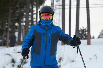 Fototapeta na wymiar Close-up of a skier in a sports helmet and ski goggles
