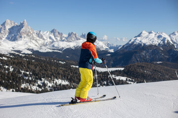 Happy family, enjoying ski holiday with children, sunny beautiful weather