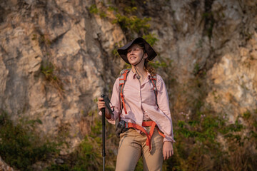 Tourists with backpacks hike on rocky top mountain trekking is adventure sport for Traveller who love hiker on summer holidays trekking and activity.
