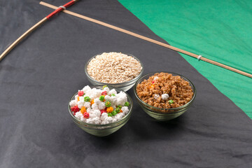 Indian makar sankranti festival food or sweets. Tilgul in a small bowl. Tilgul is made out of sesame seeds, peanuts, and jaggery. Til gud chikki or sesame candy. Copy Space.