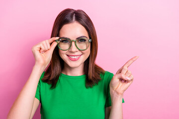 Portrait of lovely cheerful girl beaming smile hand touch glasses indicate finger empty space...
