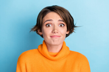 Photo portrait of pretty young girl cute confused face forget sorry wear trendy orange garment...