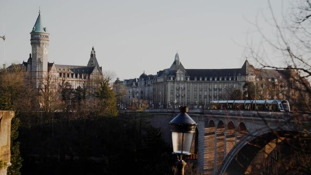 Luxembourg Adolf Bridge and city skyline, people walking. 4k 24fps. Tripod. 