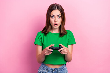 Photo of impressed pretty lady pouted lips arms hold controller playing games isolated on pink color background - obrazy, fototapety, plakaty