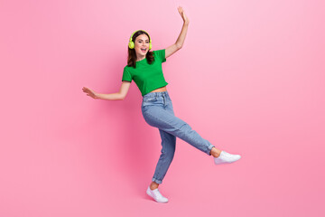 Full length portrait of pretty cheerful person enjoy dancing listen music headphones isolated on pink color background