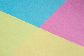 Blue, pink and yellow paper texture background. Blank paper surface for designs.