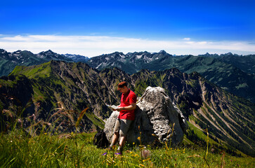 Hiker in the mountains, Allgäu Alps, Oberstdorf, Bavaria, Germany.