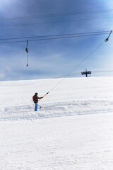 Fototapeta na wymiar Skier On Ski Lift And On Slope