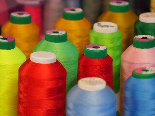 spools of yarn of various colors for fabric manufacturing industries