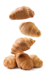 Croissants fall on a pile on a white background. Isolated