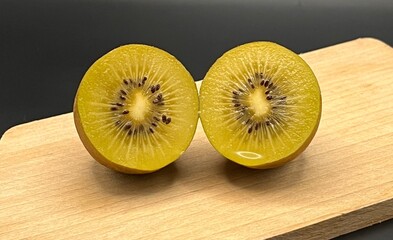 sliced kiwi on a wooden board