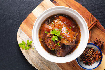 Food concept Spot focus Homemade Asian 5 spice  braised pork on black background with copy space