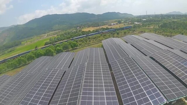 Drone Chasing A Train Flying Over Solar Panels