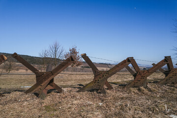 Iron anti-tank obstacles in the meadows with the Kralicky Sneznik. Lichkov, Pardubice region, Czech republic.