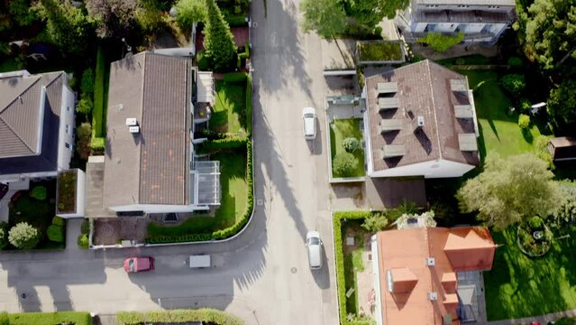 Beautiful view of buildings with green trees and road in the city of Munich, Germany